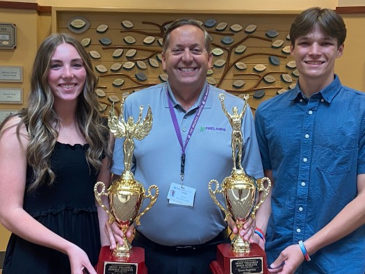 TBHF Director Dennis Sabo recently presented the trophies to BHS Seniors Brooke Brown and Tyson Baptista 